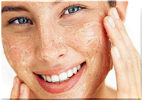 woman using exfoliator for healthy soft skin