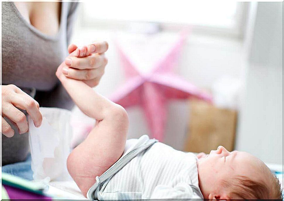 mother treating her baby's diaper rash