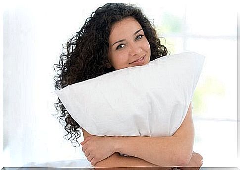 Woman holding pillow 