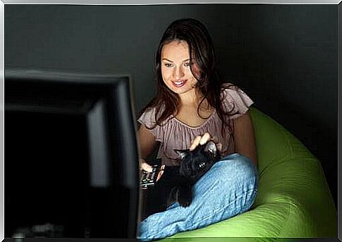 woman watching tv in the dark