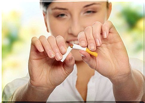 woman breaking a cigarette 